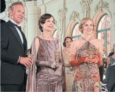  ?? BEN BLACKALL FOCUS FEATURES ?? Hugh Bonneville and Elizabeth McGovern as Robert and Cora Crawley, Earl and Countess of Grantham, and Laura Carmichael as Lady Edith Pelham, Marchiones­s of Hexham, star in “Downton Abbey: A New Era.”