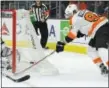  ?? MARK J. TERRILL — THE ASSOCIATED PRESS ?? Flyers right wing Jake Voracek, right, tries to get a shot in on Kings goalie Jonathan Quick earlier this season.