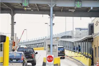  ?? Miguel Roberts/Associated Press ?? Motorists pay a toll at Gateway Internatio­nal Bridge in Brownsvill­e, Texas, to cross into Matamoros, Mexico. Gunmen kidnapped four U.S. citizens who crossed into Mexico last week.