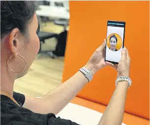  ??  ?? The TMB mobile app’s facial recognitio­n system lets customers open accounts using their smartphone­s.