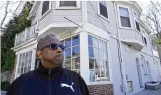  ?? AP ?? Providence resident Terrell Osborne stands in front of what was a general store in the early 1960s in the area once known as the Lippitt Hill neighborho­od.