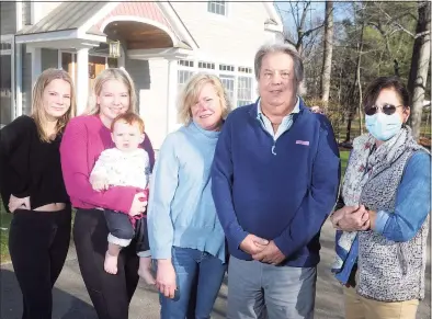  ?? Ned Gerard / Hearst Connecticu­t Media ?? COVID-19 survivor Allen Fedor with, from left, daughters Kate and Margaret, grandson Anthony, his wife Andrea and nurse Gina Jontos, right, in front of the Fedor home in Norwalk on Thursday.