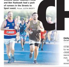  ?? Picture: JUSTIN BRIERTY ?? SHARED GOAL: Shannon Pinner and Ben Razbusek lead a pack of runners in the Streets to Sport event.