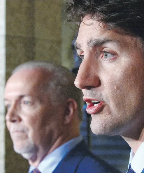  ?? SEAN KILPATRICK / THE CANADIAN PRESS ?? Prime Minister Justin Trudeau and new B.C. Premier John Horgan address the media on Parliament Hill Tuesday.