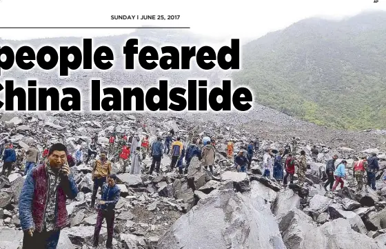  ?? AP ?? Emergency personnel and locals work at the landslide site in Xinmo village in Maoxian county in southweste­rn China’s Sichuan province.