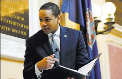  ?? Steve Helber The Associated Press ?? Virginia Lt. Gov, Justin Fairfax looks over a briefing book prior to the start of the Senate session Thursday in Richmond, Va.