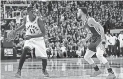  ??  ?? Raptors forward Pascal Siakam, left, drives against Warriors guard Stephen Curry during the fourth quarter.