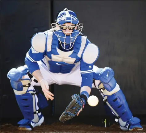 ?? PHOTOS: NATHAN DENETTE/THE CANADIAN PRESS ?? Danny Jansen, 23, puts Toronto younger at catcher as he’ll take over from 36-year-old Russell Martin.