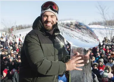  ?? GRAHAM HUGHES THE CANADIAN PRESS FILE PHOTO ?? Super Bowl champ and McGill med school grad Laurent Duvernay-Tardif, seen posing with an ice sculpture of the Vince Lombardi Trophy in Montreal, is Rick Salutin’s pick for Canada’s next governor general.