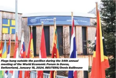  ?? ?? Flags hang outside the pavilion during the 54th annual meeting of the World Economic Forum in Davos, Switzerlan­d, January 18, 2024. REUTERS/Denis Balibouse