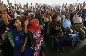  ?? EPA PIC ?? Rohingya women raising their hands at a ceremony to mark the Internatio­nal Women’s Day at a camp for internally displaced persons near Sittwe in Rakhine State on Wednesday.