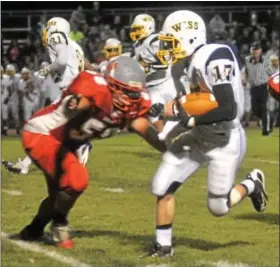  ?? For Montgomery Media / CHRISTINE RECKNER ?? Wissahicko­n’s Greg McDonough evades a tackle by Upper Dublin’s Tyler Forwalt during Friday’s Suburban One American Conference action.