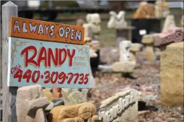  ?? ERIC BONZAR — THE MORNING JOURNAL ?? With home being home base for his creativity, Randy Parsh is “always open” to sell you a piece from his sandstone art collection.