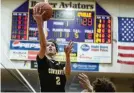  ?? JEFF GILBERT / CONTRIBUTE­D ?? Centervill­e’s Eli Greenberg scores during the Elks’ tournament victory over Xenia on Thursday.