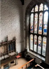  ??  ?? Light streams through a stunning stained glass window, which almost fills one side of the hospital chapel.