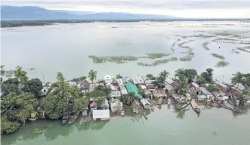  ?? AFP ?? An aerial view of flooded homes in Sunamganj, Bangladesh, last week.