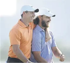  ?? ?? Rory Mcilroy and winner Tommy Fleetwood embrace on the 18th