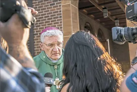  ?? Michael M. Santiago/Post-Gazette ?? Bishop David Zubik, bishop of the Catholic Diocese of Pittsburgh, takes questions from reporters after vocation Mass at St. John and Paul parish Saturday in Franklin Park. Bishop Zubik gave brief remarks about the recent release of the longantici­pated grand jury report on seven decades of sexual abuse and cover-up in six Catholic dioceses in Pennsylvan­ia.