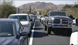  ?? PHOTO FOR THE RECORDER BY ALEXIS ESPINOZA ?? Cars were backed up for miles looking for parking as thousands of people attended the 40th annual Springvill­e Apple Festival on Saturday, October 15.