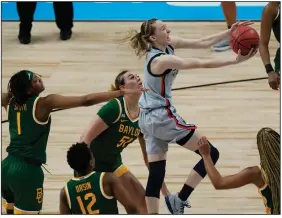  ?? (AP/Eric Gay) ?? Connecticu­t guard Paige Bueckers drives to the basket during Monday’s River Walk Region final against Baylor at the Alamodome in San Antonio. Bueckers finished with 28 points to lead the Huskies to a 69-67 victory to advance to the Final Four.