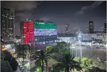  ?? THE ASSOCIATED PRESS ?? Tel Aviv City Hall is lit up with the flag of the United Arab Emirates as the UAE and Israel announced they would be establishi­ng full diplomatic tie.