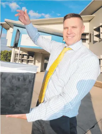  ?? Picture: MIKE BATTERHAM ?? Pimpama State Secondary College principal John Thornberry has students using mobile phones to help curb cyber bullying and to improve social behaviour.