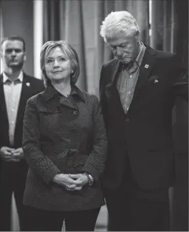  ?? Photo by Melina Mara — The Washington Post ?? Former secretary of state Hillary Rodham Clinton and her husband former president Bill Clinton appear at a Democratic party event in Iowa on Nov. 15.