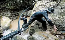  ?? SAKCHAI LALIT/AP ?? Rescuers are scrambling to pump out water from a flooded cave Saturday in Thailand.
