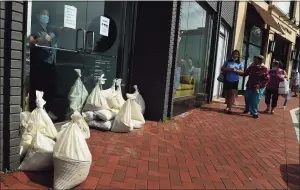  ?? Erik Trautmann / Hearst Connecticu­t Media ?? Employees at West Elm close early to prepare for flooding ahead of Hurricane Henri Saturday in Westport.