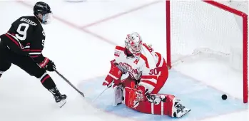  ?? THE ASSOCIATED PRESS ?? Northeaste­rn forward Tyler Madden beats Boston University goaltender Jake Oettinger for the game-winning goal in overtime during the first round of the Beanpot NCAA tournament Feb. 4.