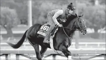  ?? Getty Images ?? OMAHA BEACH, who was sidelined several months because of illness, works out at Santa Anita.
