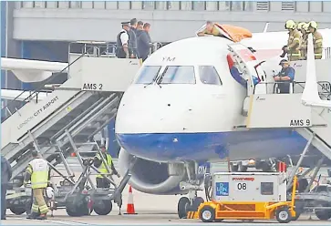  ?? Picture: REUTERS ?? A protester, who Extinction Rebellion says is former Paralympic athlete James Brown, lies on top of a British Airways plane at London City Airport, in London, Britain on Thursday.