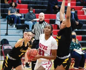  ?? JEFF GILBERT / ?? Wayne’s Bree Hall is defended by Centervill­e’s Amy Velasco (left) and Cotie McMahon during a game earlier this season. Centervill­e faces Mount Notre Dame and Wayne faces Mason in Wednesday’s Division I regional semfiinals at Princeton.