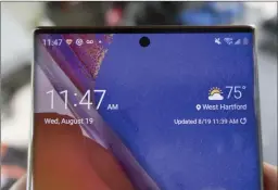  ??  ?? The bezels are thin, the camera is centred, and the screen is gorgeous on the Note20 Ultra.