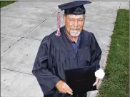  ?? ?? Larry Inman, a 63-year-old resident of Huber Heights, received his high school diploma. Inman should have graduated with the Warrior Class of 1977.