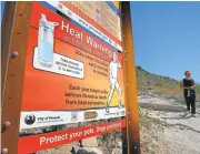  ?? MATT YORK/ASSOCIATED PRESS ?? Parks in Arizona are upgrading their warning signs after two German tourists died in the heat last weekend.