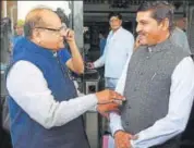  ?? HT PHOTO ?? Health minister Kali Charan Saraf (left) and MLA Ramesh Meena interact after the budget session in Jaipur on Monday.