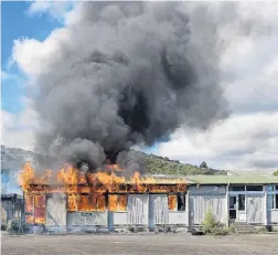  ?? PHOTO: JASON BLAIR ?? Burning . . . The disused school building fully ablaze on Thursday.