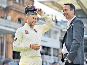  ??  ?? Past and present: Joe Root (left) celebrates with former captain Michael Vaughan