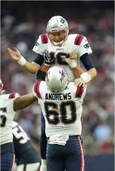  ?? AP PHotos ?? RESULTS DRIVEN BUSINESS: Mac Jones is lifted in the air by center David Andrews after a touchdown.