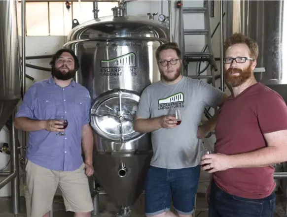  ?? HANNAH YOON/THE TORONTO STAR ?? Nate Ferguson, left, Richard Preiss and Angus Ross are co-founders of Escarpment Labs, a Canadian yeast lab in Guelph, Ont.