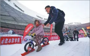  ?? XINHUA ?? The National Stadium in Beijing, aka the Bird’s Nest, hosts an ice and snow festival, setting a good example of how to maximize venue use all year round.