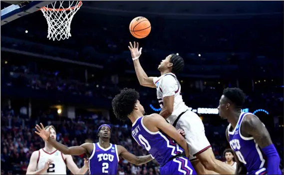  ?? HELEN H. RICHARDSON — THE DENVER POST ?? Gonzaga guard Rasir Bolton goes up for a layup against TCU guard Micah Peavy during the first half of on Sunday at Ball Arena.