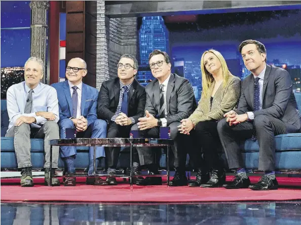  ?? CBS ?? Jon Stewart, left, Rob Corddry, John Oliver, Stephen Colbert, Samantha Bee and Ed Helms reunited Tuesday on The Late Show with Stephen Colbert. “This arrangemen­t we have right now,” Colbert said, “is exactly something we would have made fun of on The Daily Show: It looks like a morning show.”