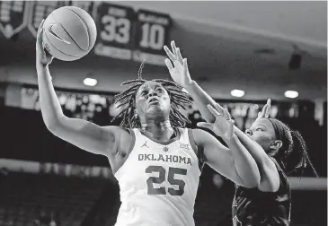  ?? [PHOTO BY BRYAN TERRY, THE OKLAHOMAN] ?? Oklahoma’s Madi Williams, left, goes past Central Arkansas’ Alana Canady during Dec. 5 game at Lloyd Noble Center. The Sooners take on national power Connecticu­t on Wednesday in Norman.