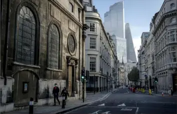  ?? Andrew Testa/The New York Times ?? A street in London is left nearly empty as the city entered the first day of lockdown restrictio­ns to help curb the spread of the coronaviru­s on Nov. 5.