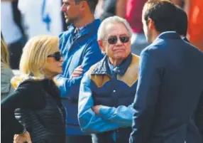  ??  ?? Los Angeles Galaxy owner Phil Anschutz, center, and his wife, Nancy, chat with friends before an MLS playoff game against the Colorado Rapids on Nov. 6, 2016, in Commerce City. Neil Gorsuch did legal work for Anschutz before his appointmen­t to the...