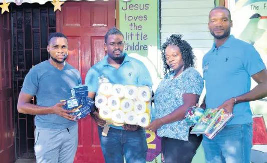  ?? PHOTO BY ANTHONY MINOTT ?? From left: Shane Nelson and Germaine Gordon, founders of the Daytona Premier League (DPL), and former national cricketer David Bernard Jr (right), hand over supplies to Marsia Tucker of the Strathmore Children Home recently. The donation was funded from proceeds from the DPL. This is a community football league that organisers say was contrived out of a desire to foster love and unity within the Greater Portmore community. The league hosts nightly games on Saturdays and Sundays.