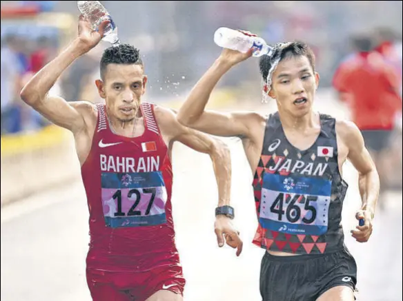  ?? AFP ?? While most events at the World C’ships will take place inside the air-conditione­d Khalifa stadium, race walkers and marathon runners will have to deal with the heat threat.