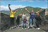  ?? BU XIANGDONG / FOR CHINA DAILY ?? Foreigners celebrate at the Mutianyu section of the Great Wall in Huairou, Beijing, this summer.